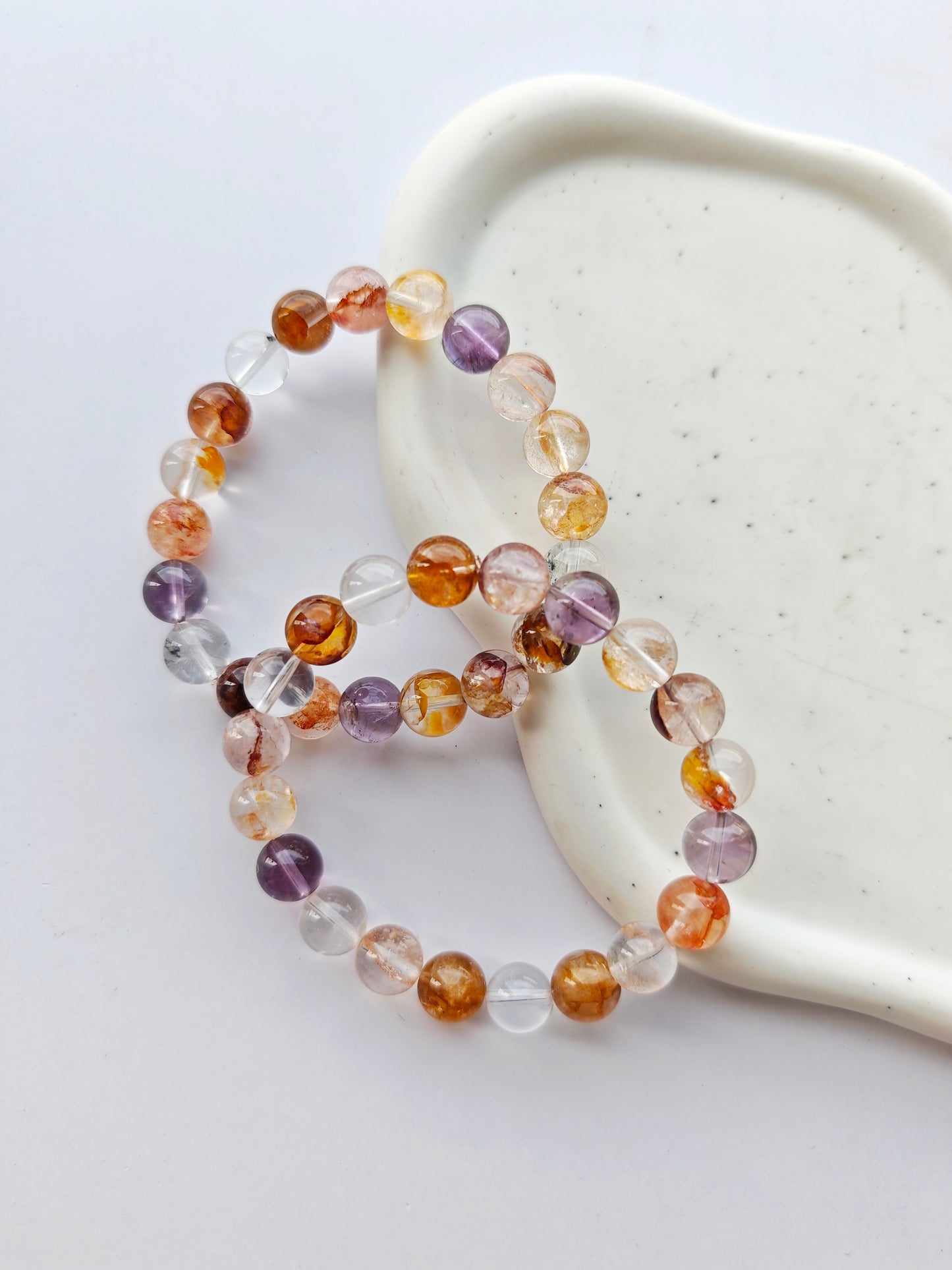 Bergkristall x Golden Healer, Feuerquarz x Amethyst Armbänder